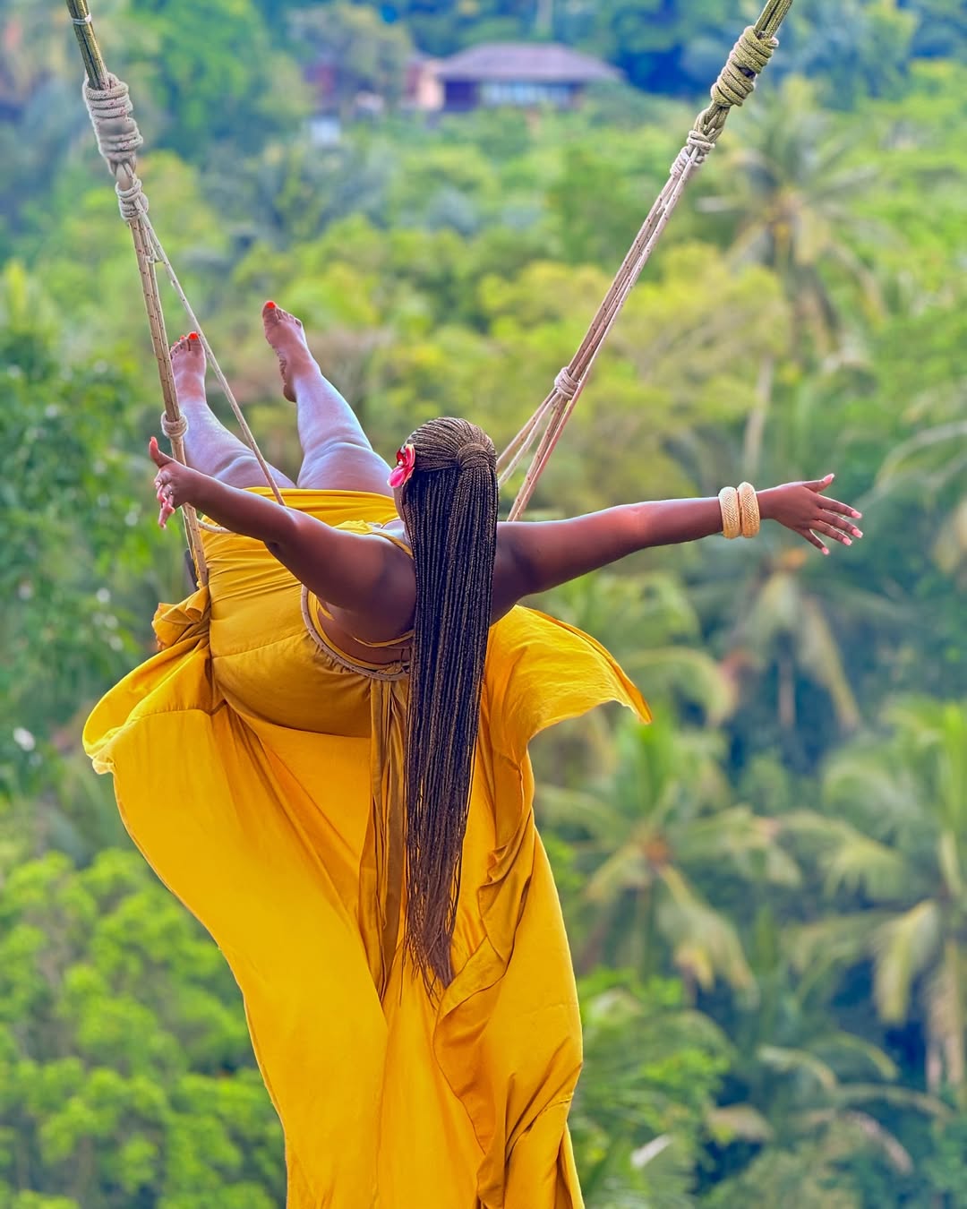 Woman on the Ubud swing over the jungle